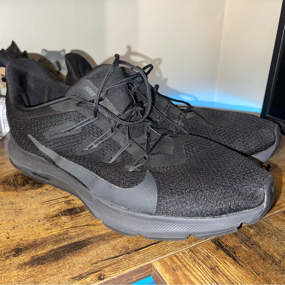 All back Nike running shoes